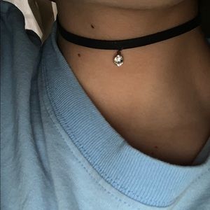 black choker, pink lace choker, and beaded choker